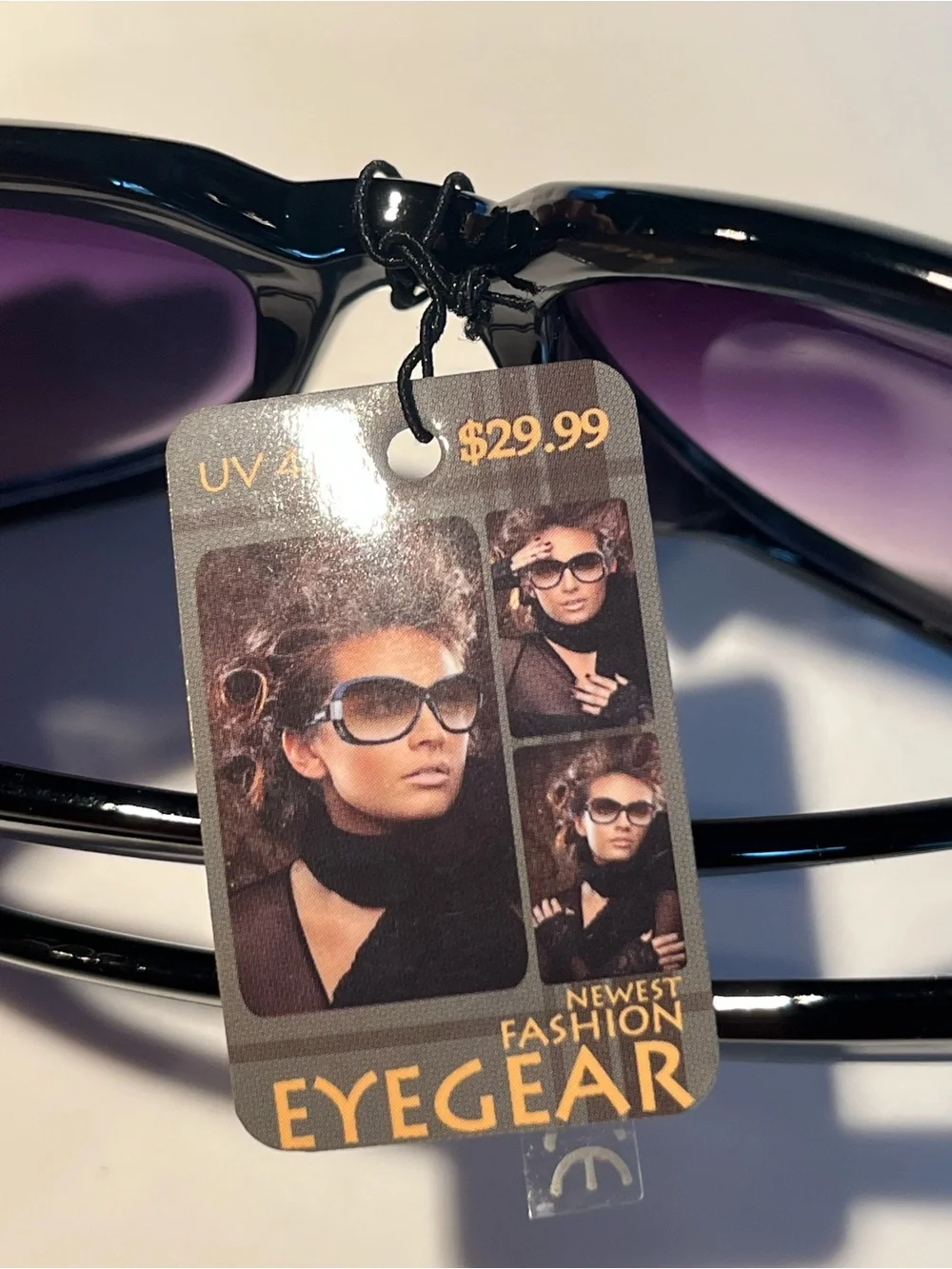 NWT fabulous oversized black sunglasses with violet lenses.